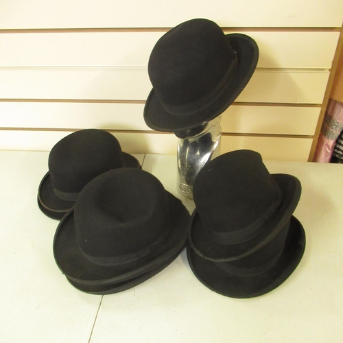 66 - Black bowler hats