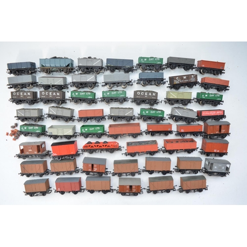 125 - Collection of Fifty four used OO gauge goods wagons, some re-painted. Condition varies, please refer... 