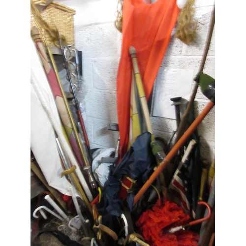 1113 - Large collection of theatre/drama props inc. banners, flags, walking canes/sticks, prop swords, etc.... 