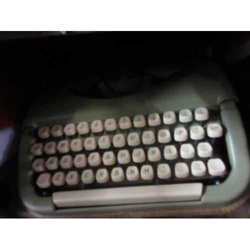 1130 - Cased Bulgarian typewriter and a wood case containing two glass decanters