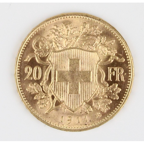 911 - Switzerland 1911 gold 20 Francs, obverse of Helvetia facing left with Alps, reverse Swiss cross in s... 