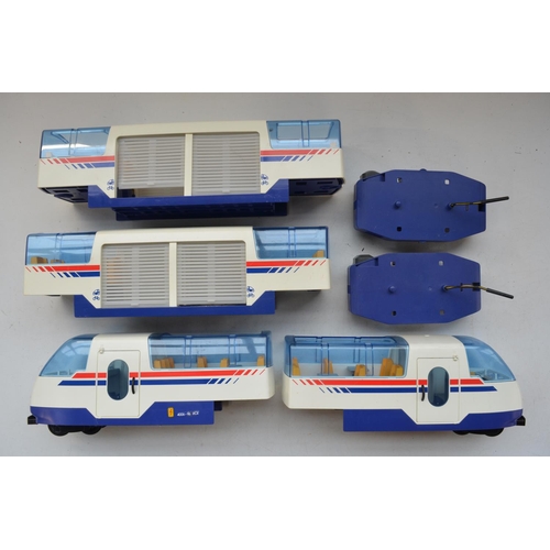 216 - Collection of Playmobil streamlined trains with transmitters, a battery charging station etc, all us... 