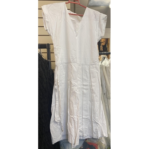 775 - Women's white tennis dresses and skirts, approx.15 total, and a quantity of sailor style dresses and... 