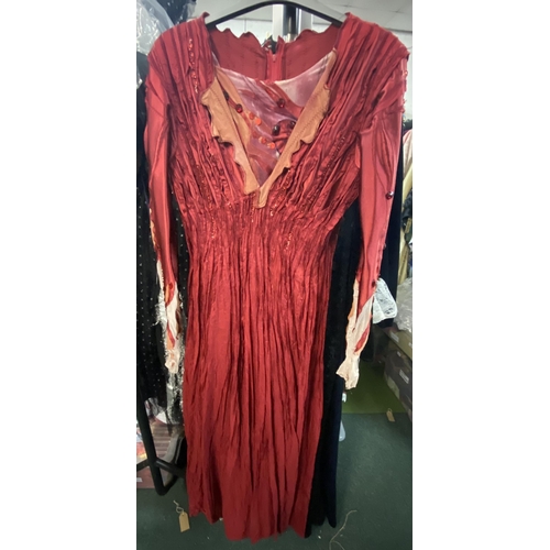 529 - Two ex-Opera North female costumes; medieval queen and red fantasy dress, and a silk ex theatre medi... 