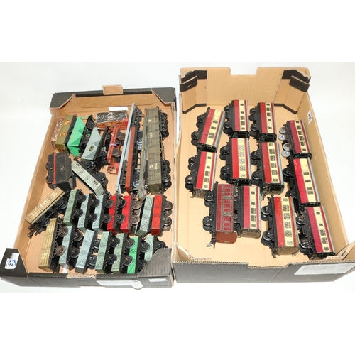 135 - Hornby 0 gauge tin plate mixed goods wagons including twin bogey flat beds , open goods vans hopper ... 