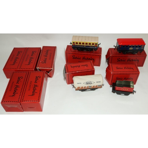 187 - Thirty three Hornby 4 hatchet boxed O gauge locomotives and rolling stock (2 boxes)