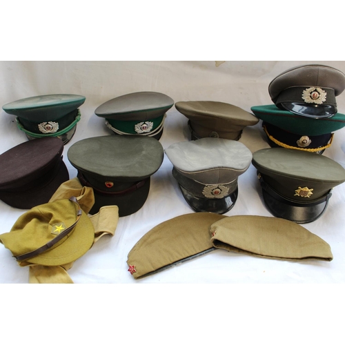 845 - Collection of military caps including Japanese soldier jungle cap, Russian officers caps, Russian fo... 