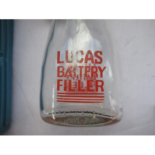 524 - Lucas glass Battery Filler with red spout,  and a Diamond blue plastic Battery Filler, H24cm max (2)