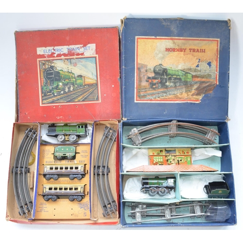 328 - Two vintage O gauge train sets, a tinplate Hornby clockwork set (no key) with a 0-4-0 loco and tende... 