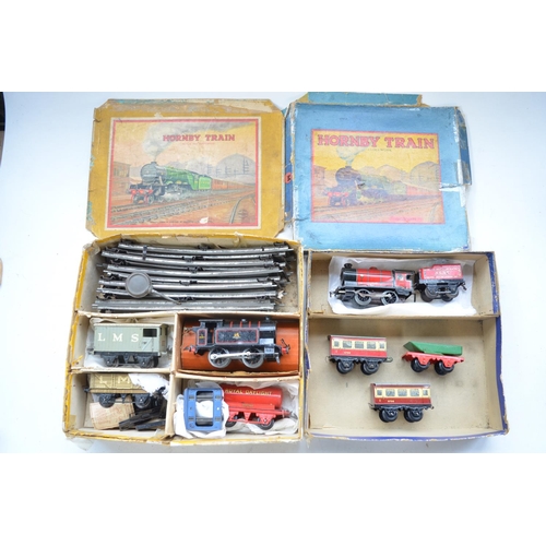 330 - Two boxed vintage Hornby clockwork train sets to include 2x 0-4-0 locos, BR black Type 40 (in workin... 