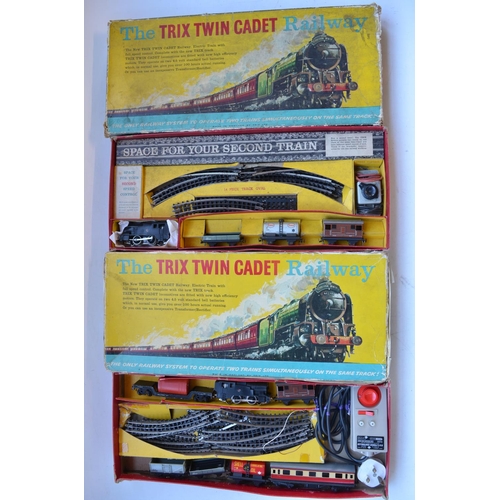 340 - Two OO gauge 3 rail electric Trix Twin Cadet Railway sets with 2x 0-4-0 BR black tank engines, a col... 