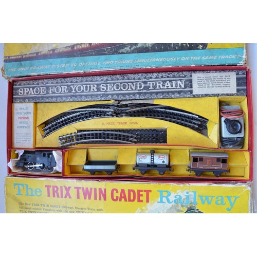 340 - Two OO gauge 3 rail electric Trix Twin Cadet Railway sets with 2x 0-4-0 BR black tank engines, a col... 