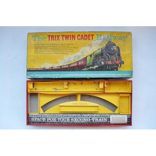 340 - Two OO gauge 3 rail electric Trix Twin Cadet Railway sets with 2x 0-4-0 BR black tank engines, a col... 