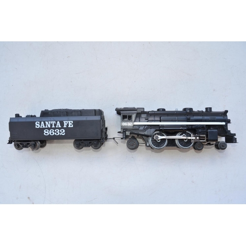 346 - Lionel Trains O gauge Santa Fe electric train set with track, wagons, vehicles, speed controller/tra... 