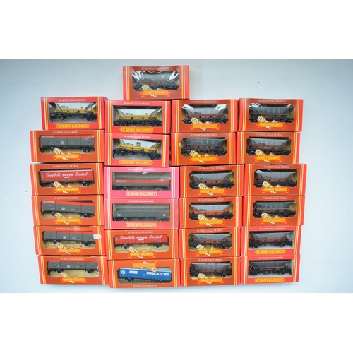 399 - Twenty five boxed Hornby OO gauge goods wagons to include curtain sided vans, open wagons, closed va... 