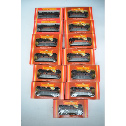 399 - Twenty five boxed Hornby OO gauge goods wagons to include curtain sided vans, open wagons, closed va... 