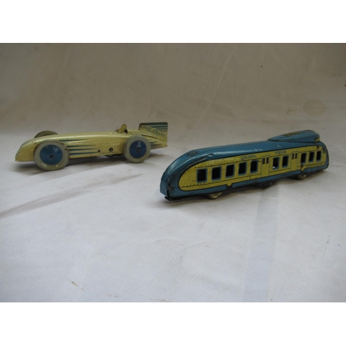 411 - Chad Valley Harborne cream and blue tinplate clockwork Racing or Land Speed Record car, and a Wells ... 