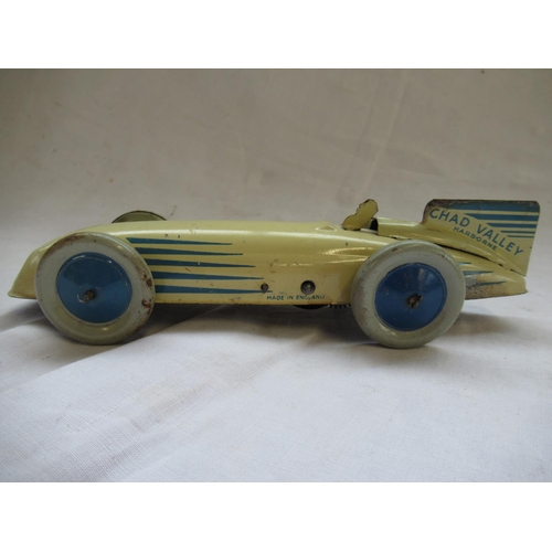 411 - Chad Valley Harborne cream and blue tinplate clockwork Racing or Land Speed Record car, and a Wells ... 