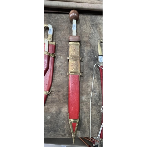 1269 - Replica Roman centurion's gladius short sword with faux bone handle, red leather sheath with brass d... 