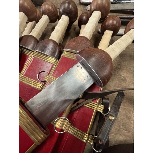1271 - Replica Roman centurion's gladius short swords with faux bone handle, red leather sheath with brass ... 