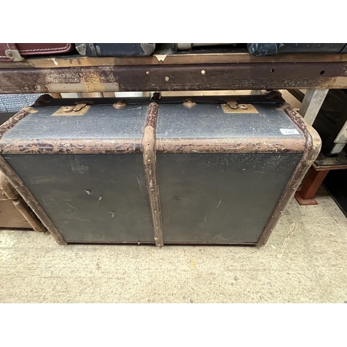 1287 - Navy vintage travelling trunk, two tin trunks, and a brown leather suitcase (4)