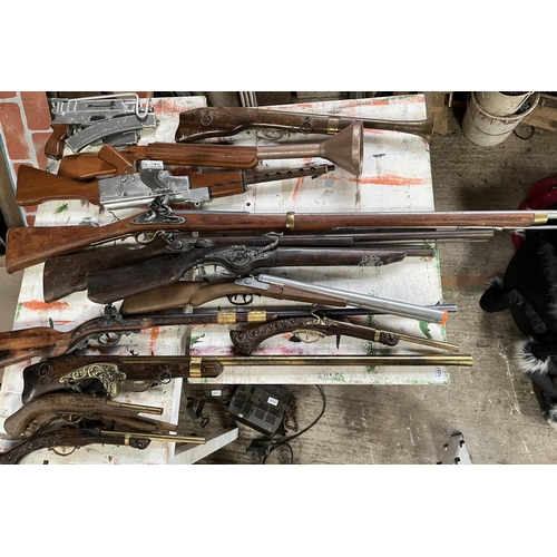 1257 - Quantity of replica/stage prop guns including a shotgun, flintlock pistols, AK-47, blunderbusses, et... 