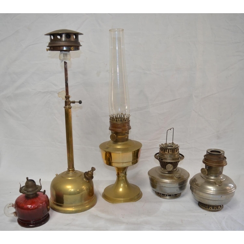 1194 - Five vintage oil lamps, some incomplete, no manufacturers marks