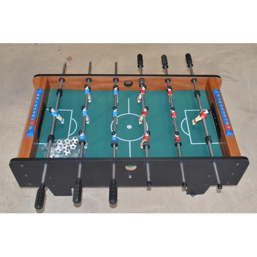 1098 - Table football game with spare balls, W94 D51 H31cm