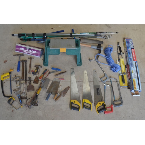 1102 - Collection of hand and garden tools incl. pick axe, tree pruner, drain rod kit, Stanley saws, wall a... 