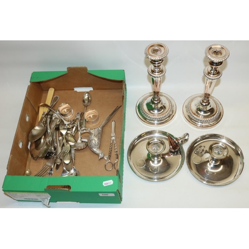 296 - Collection of silver plate including a pair of candlesticks, H26cm, two chambersticks, cutlery, phea... 