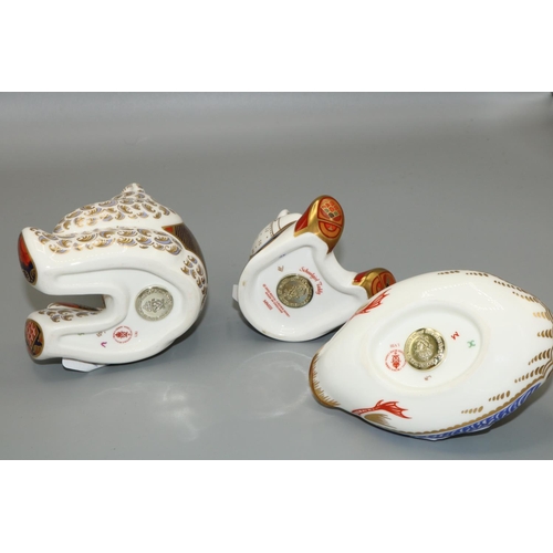 423 - Royal Crown Derby paperweights: seated bear with blue bow tie and blue and red waistcoat, H12cm, Sch... 