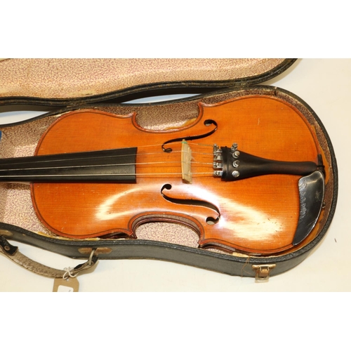 438 - Violin and bow decorated with mother of pearl, cased