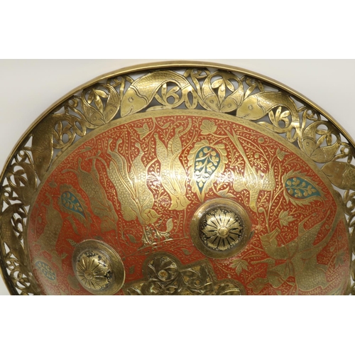 717 - Indo-Persian circular brass shield with four central bosses, pierced and enamelled decoration, D35cm