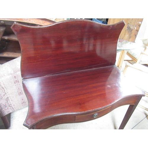 710 - Geo.III style mahogany serpentine folding tea table, with frieze drawer, W91cm D90cm H73cm max