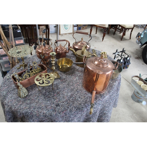 1053 - Large collection of copper and brass ware including copper kettles, kettle heater, jam pan, brass la... 