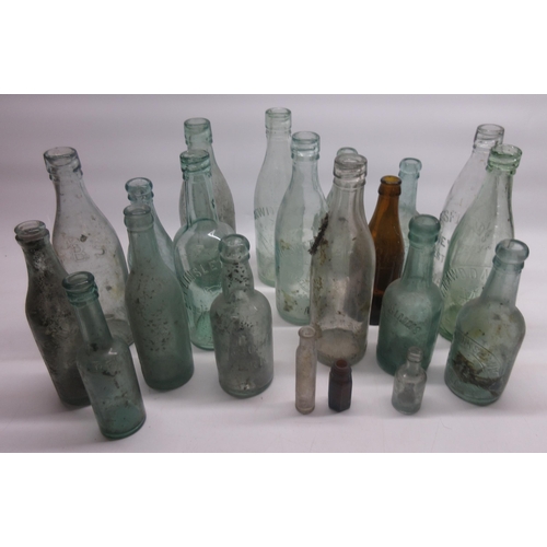 326 - Collection of 21 glass bottles, from Scarborough, Grimsby, Wakefield, etc.