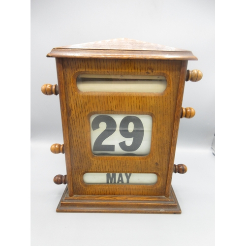 330 - Edwardian oak desk top perpetual calendar, H22.5cm W28cm D9.8cm