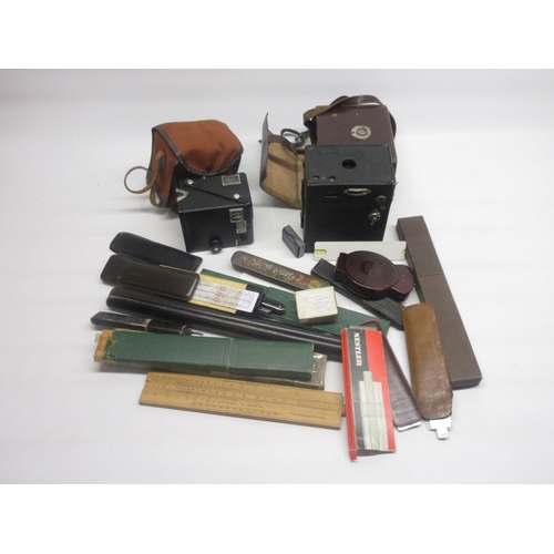 331 - Kodak No.2A Brownite camera, Kodak Brownie Six-20 Model D Camera, collection of slide rules, cut thr... 