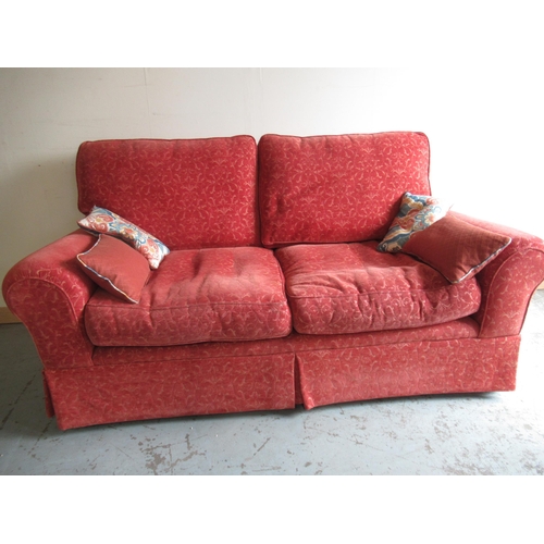 795 - Traditional shape two seat sofa, upholstered in self patterned rust fabric, loose back and seat cush... 