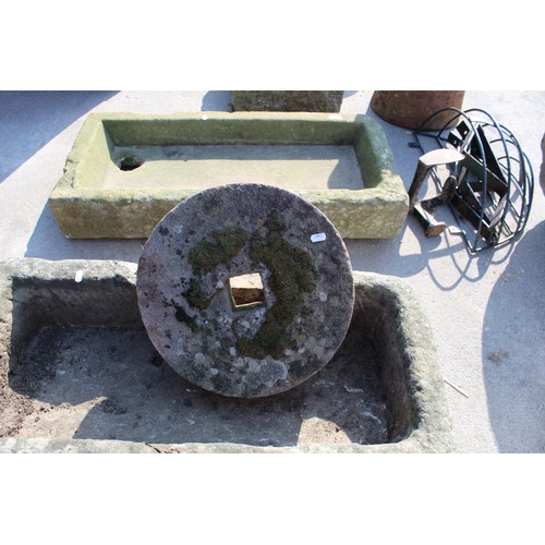 1030 - Small sandstone grindstone with square hole 38cm X 9cm