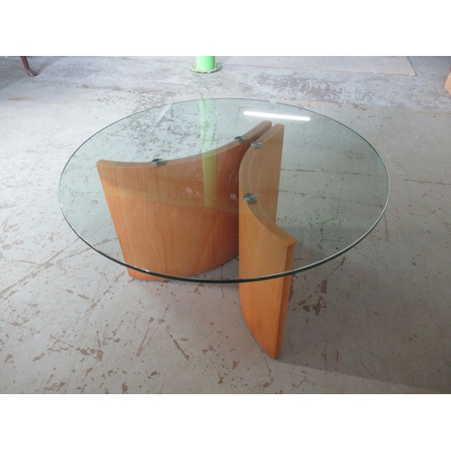 680 - Contemporary coffee table, circular smoked glass top on curved laminated supports, D75cm H42cm