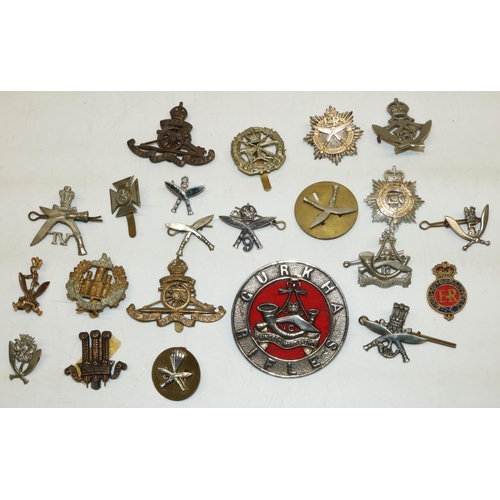 544 - Collection of badges, mainly Gurkha regiment incl. cap badges, lapel badges, Royal Artillery etc.