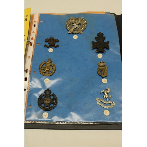 551 - Collection of military badges in 2 folders inc. the Tyneside Scottish, the Seaford 5th Battalion, Ro... 