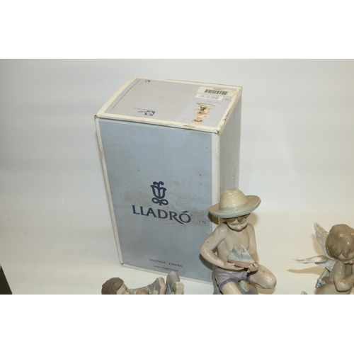 739 - Lladro porcelain figures: #6855 By the Seashore, #8035, cupid figure, and a figure of a sleeping boy... 