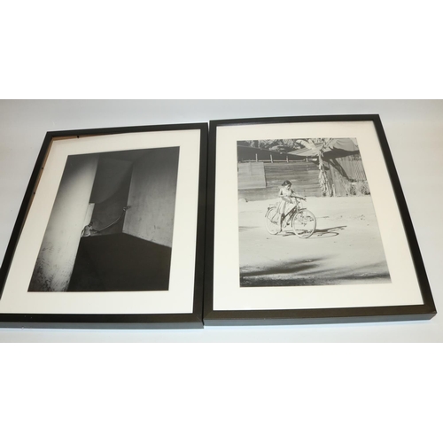 768 - Modern black and white photographic prints in black frames max. 52.5 x 42.5cm, and an unframed canva... 