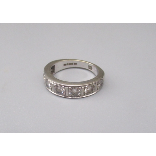 1 - 18ct white gold half eternity ring set with seven round cut diamonds, stamped 750, size O, 6.7g