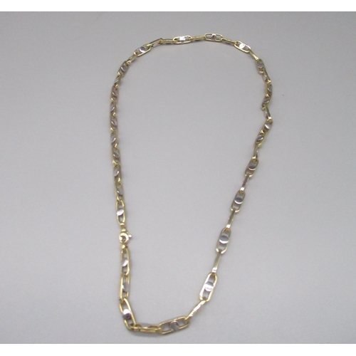 201 - 14ct yellow and white gold chain link necklace, the oval links set with central circles, stamped 585... 