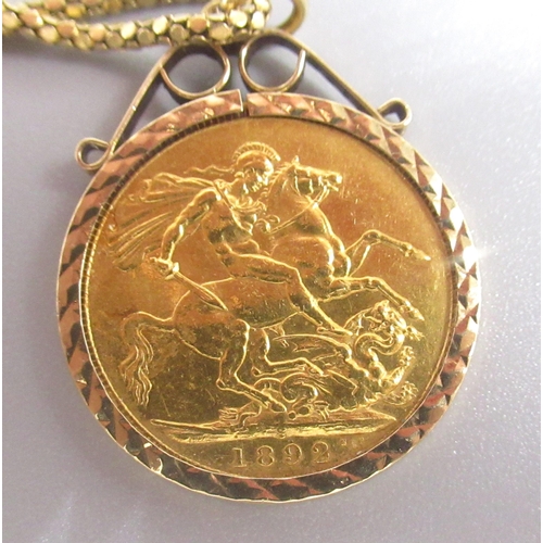 207 - Victorian 1892 full sovereign in 9ct yellow gold mount, stamped 375, 9.1g, on 18ct yellow gold chain... 