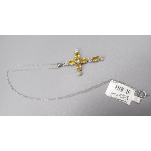 216 - 10ct white gold crucifix pendant set with oval cut yellow sapphires and round cut diamonds, on 10ct ... 