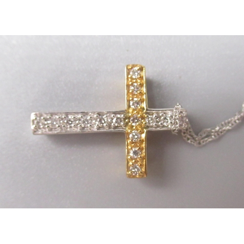 221 - Yellow and white metal crucifix pendant set with diamonds, no hallmark, on 10ct white gold chain, st... 